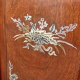 Corner showcase inlaid with mother-of-pearl, silver and copper.