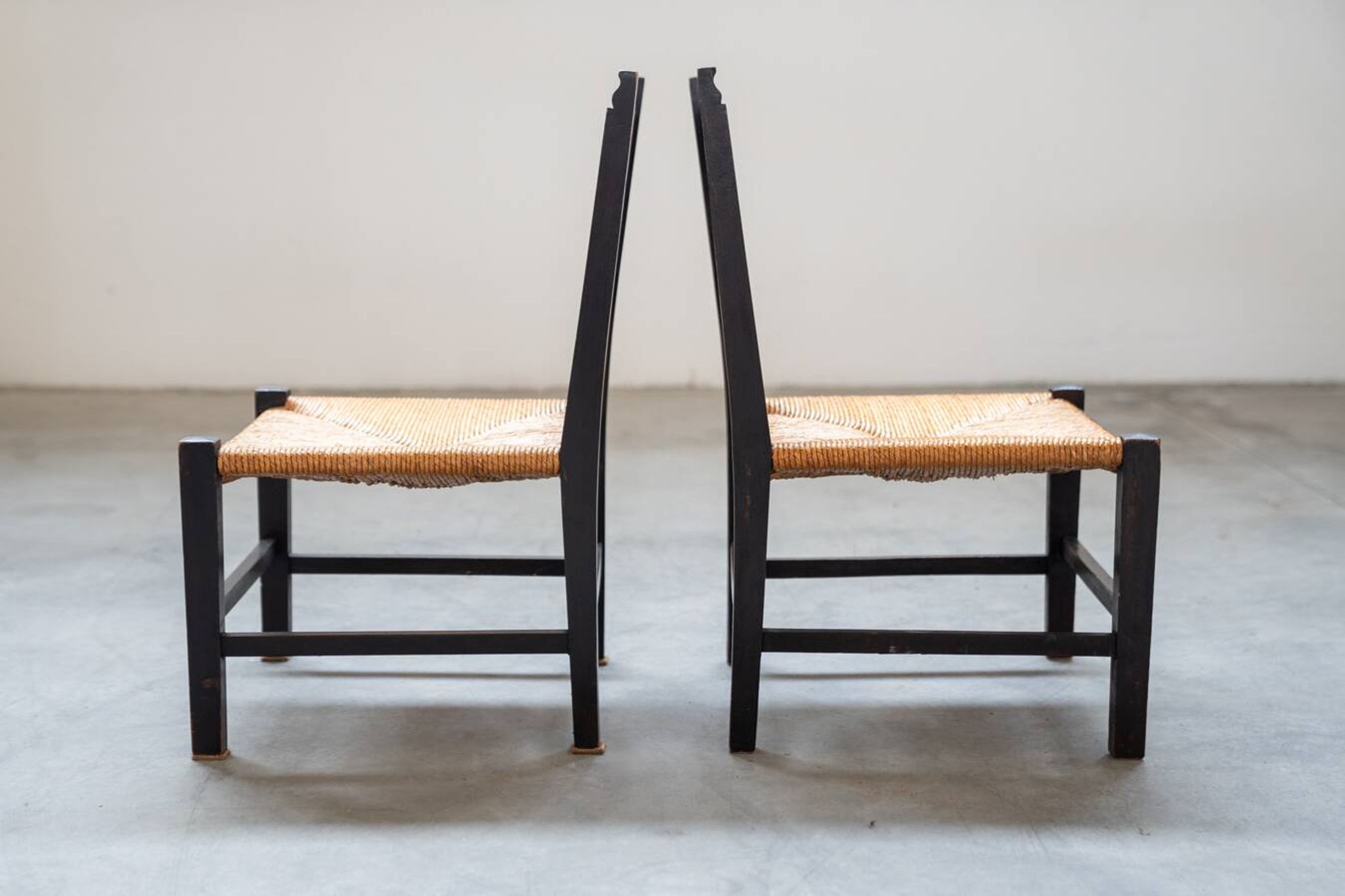 2 low bedroom chairs in hand-woven rice straw, 1950s/1960s