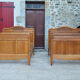 Pair of beds and Art Nouveau bedside in oak, France, circa 1910