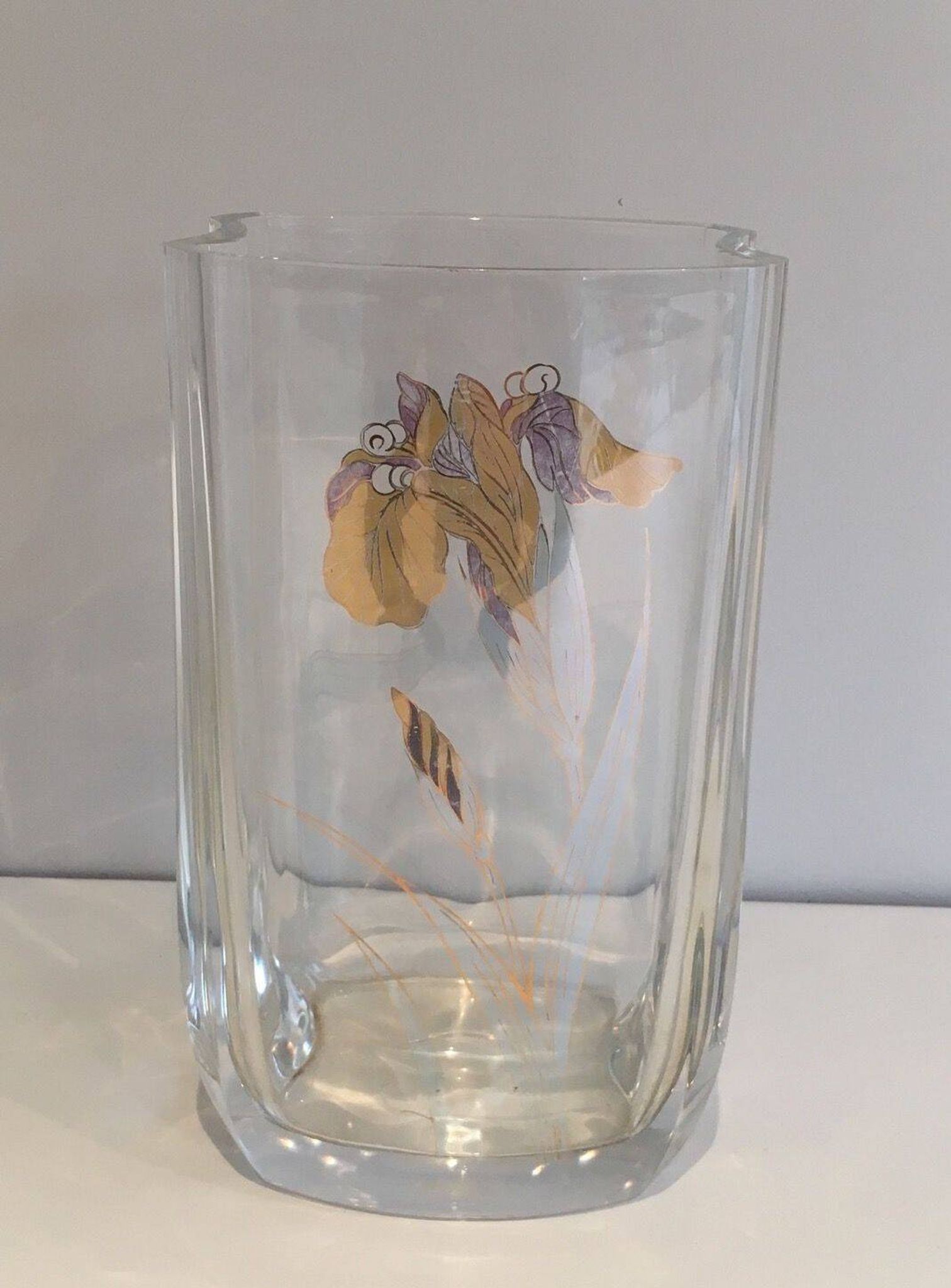 Glass vase with a decoration of a golden flower, around 1970.