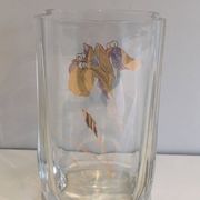 Glass vase with a decoration of a golden flower, around 1970.