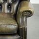 Vintage cowhide leather Chesterfield wingback armchair in a green colour