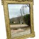 19th-century antique mirror in carved gilded wood, Napoleon style.