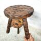 Carved wooden tripod stool