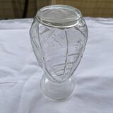 Small glass vase with leaf pattern.