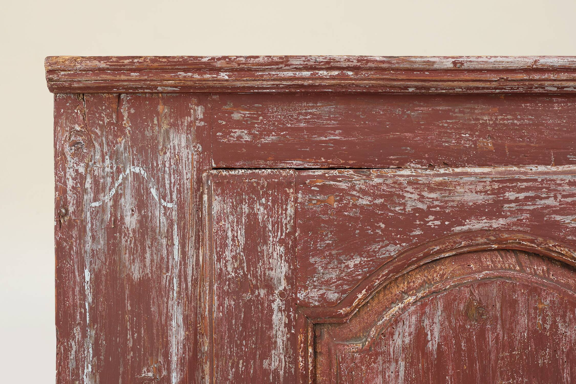 Rustic Parisian cabinet in pine wood with old burgundy paint layers, ca. 18