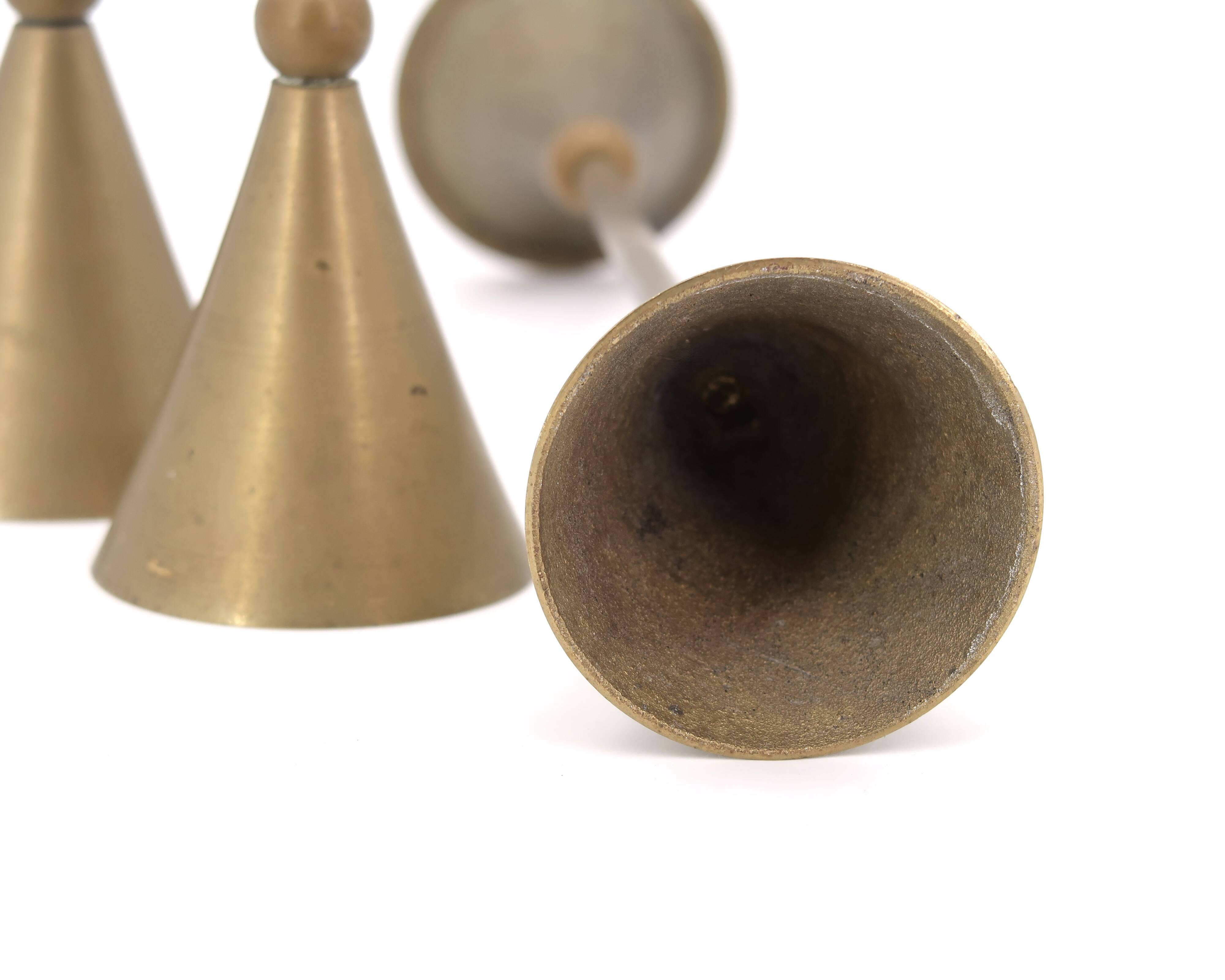 Trio of brass candlesticks, 1970s