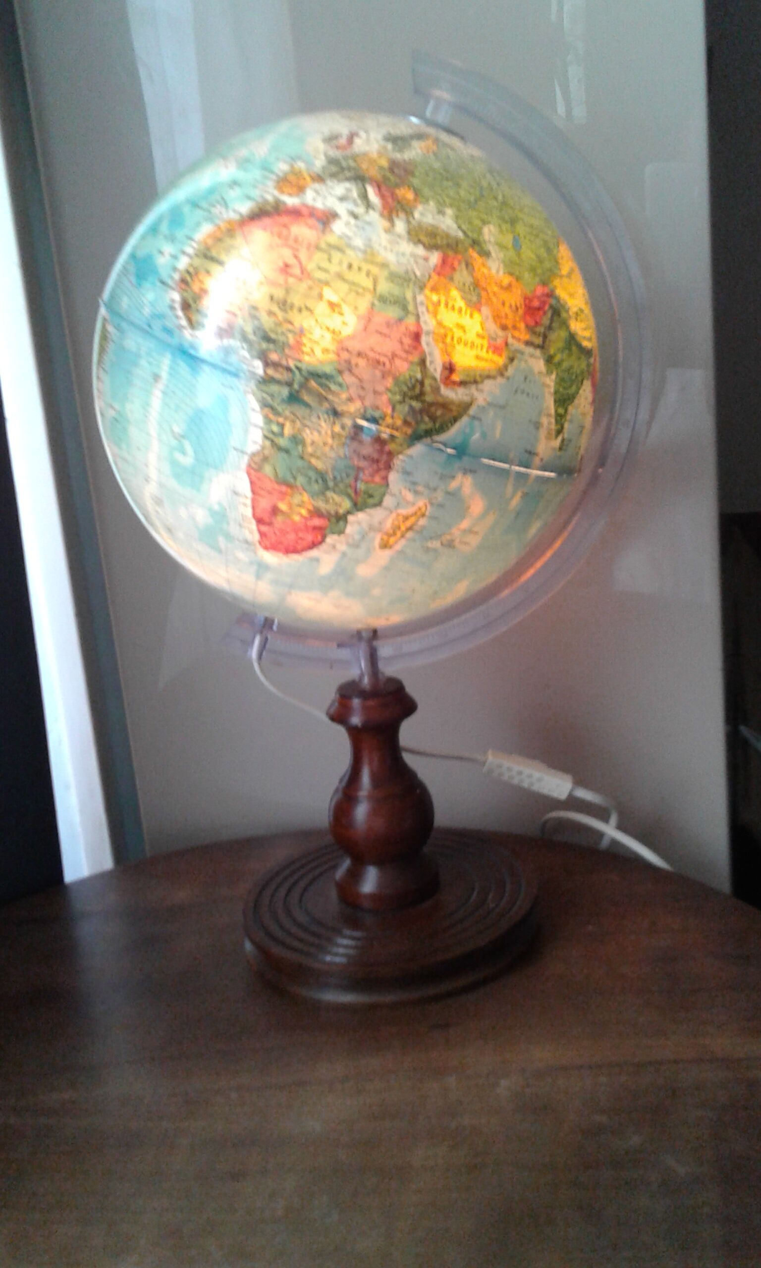 World map globe bright foot and wooden support