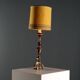 Lampe ancienne en bois sculpté doré et tissu, XXe siècle