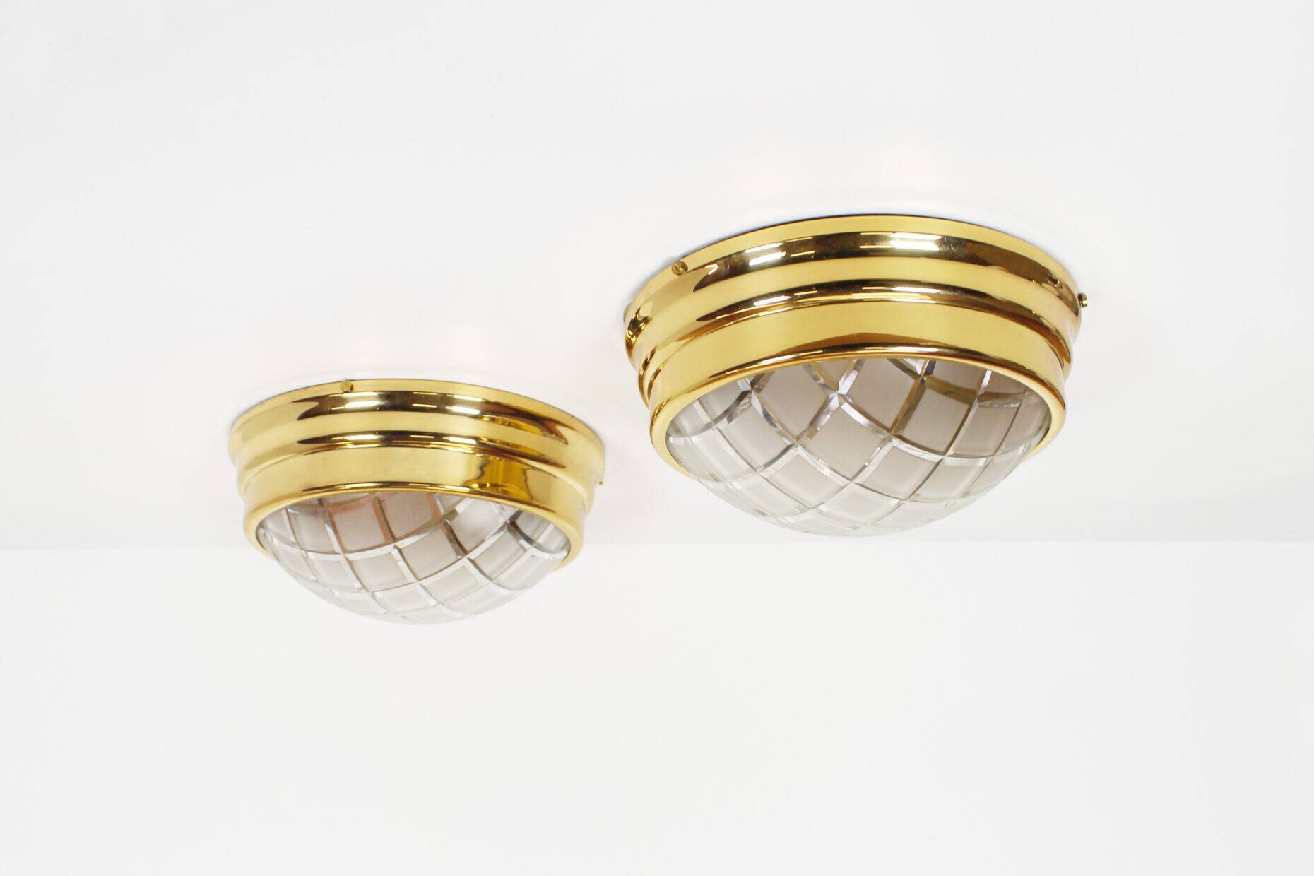 Pair of vintage brass ceiling lights with glass globe