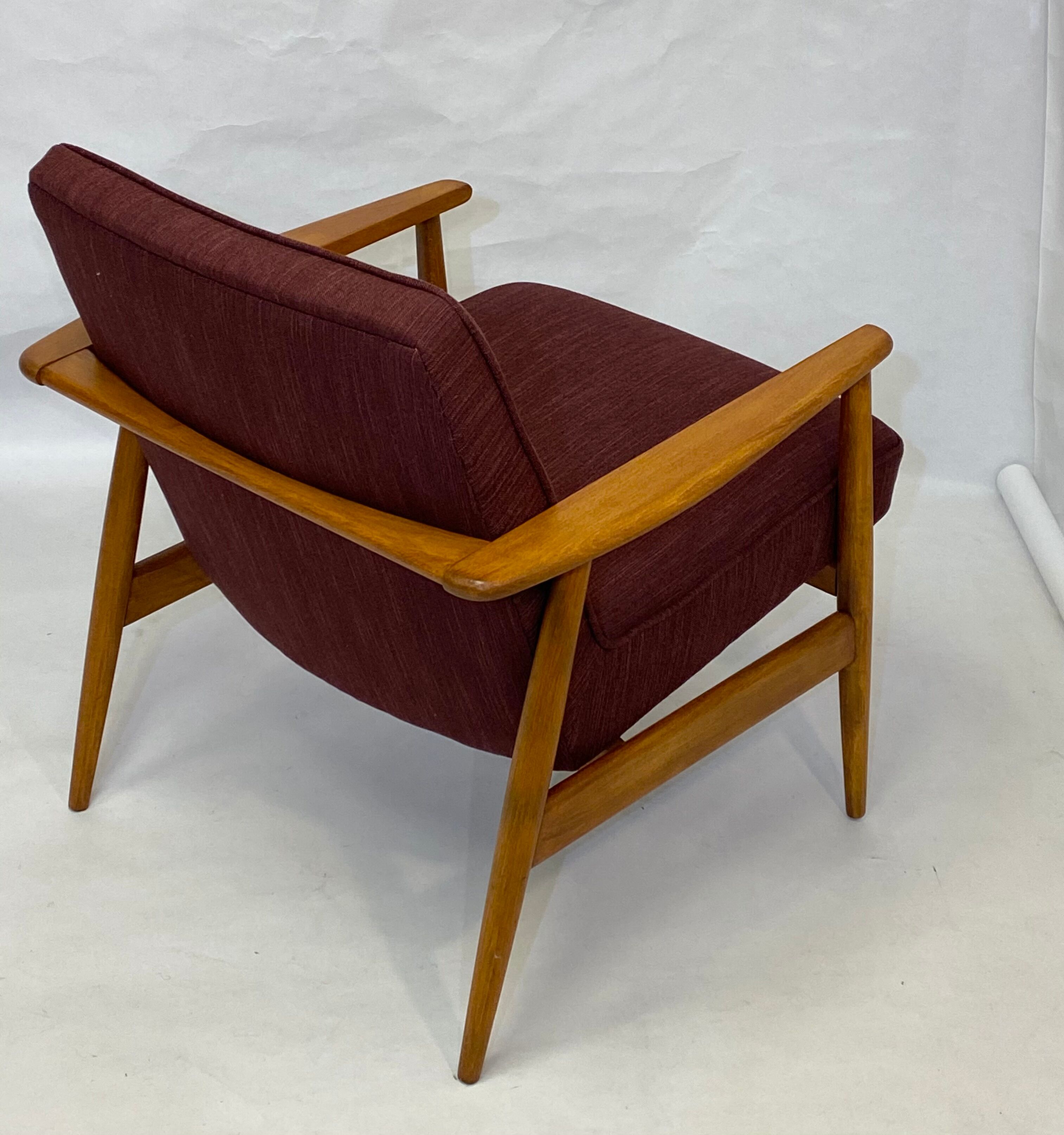 Chair created by Mr. Zieliski year 60 burgundy fabric.
