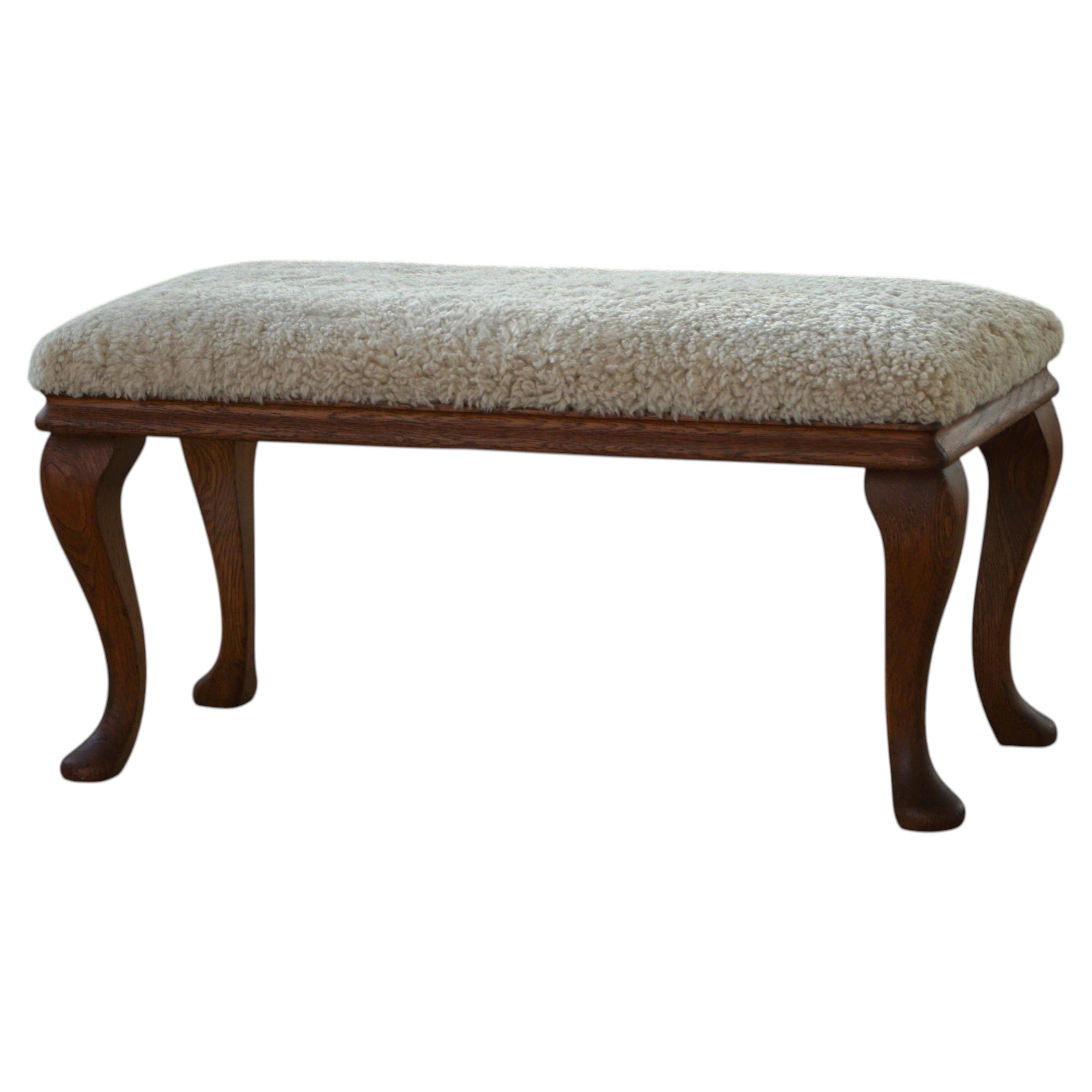 Danish rococo-style bench, cabriole legs and lambswool seat, early 20th century.