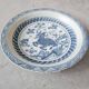 Pair of antique Chinese decorative plates with dragon motif.