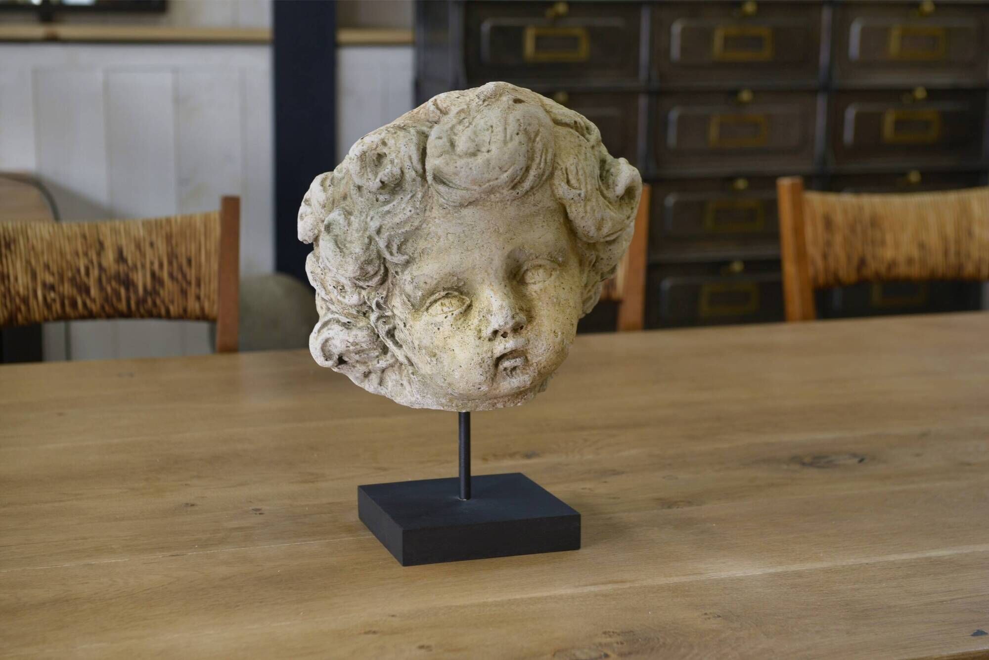 Reconstituted stone sculpture in antique style from the 20th century.