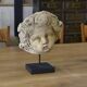 Reconstituted stone sculpture in antique style from the 20th century.
