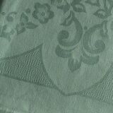 Old damask tablecloth tinted in pastel green