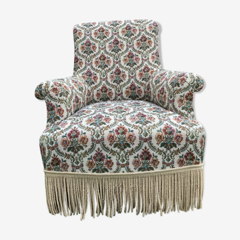 Upholstered armchair with flowers