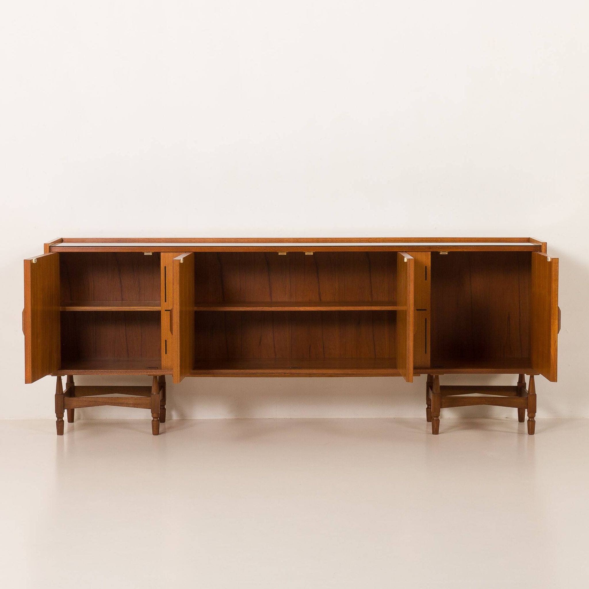 Itaian mid century teak sideboard with black glass top and inlays, 1970s