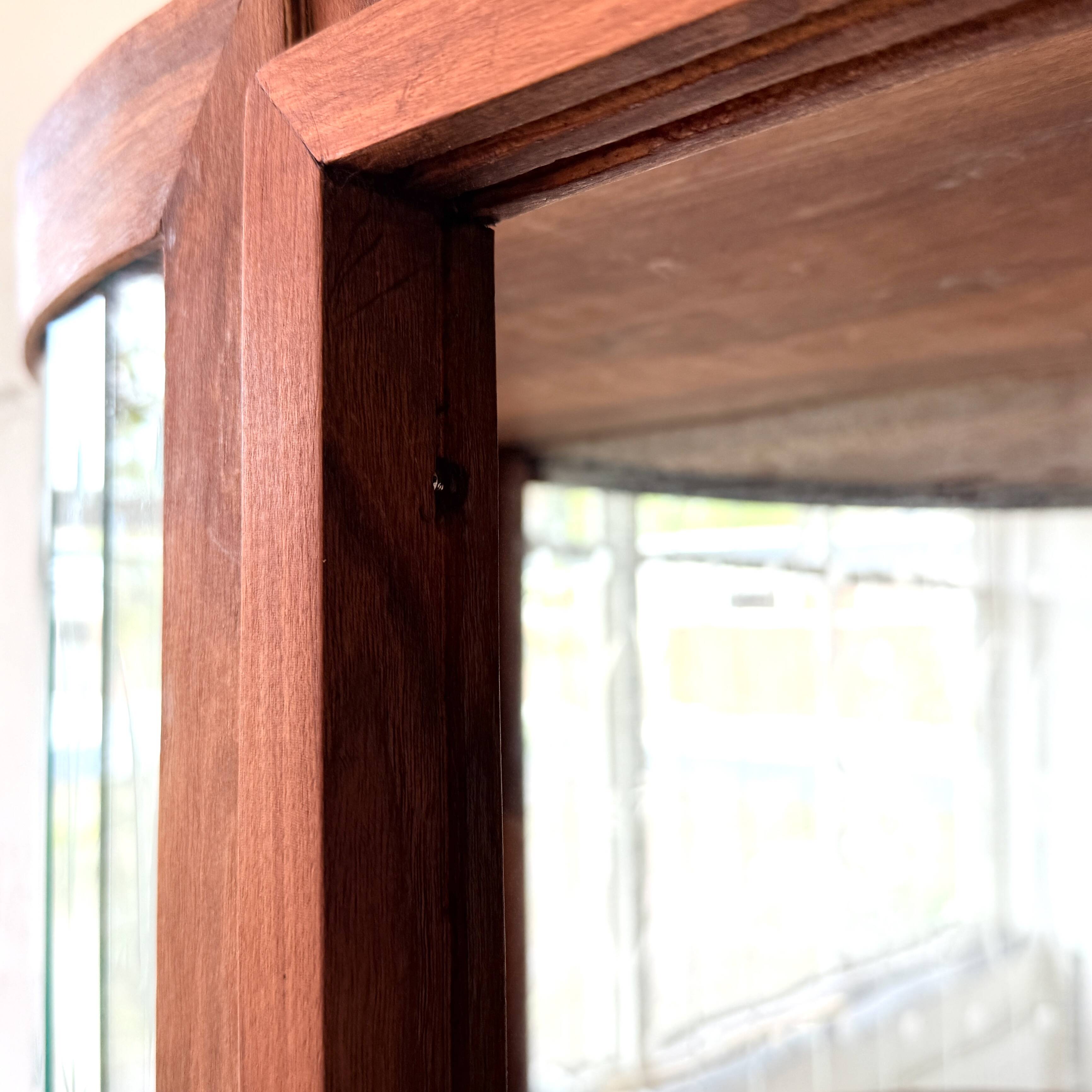 Art Deco-style wall-mounted display cabinet with floral engraving