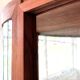 Art Deco-style wall-mounted display cabinet with floral engraving