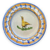 Earthenware plate representing a bird signed Lario