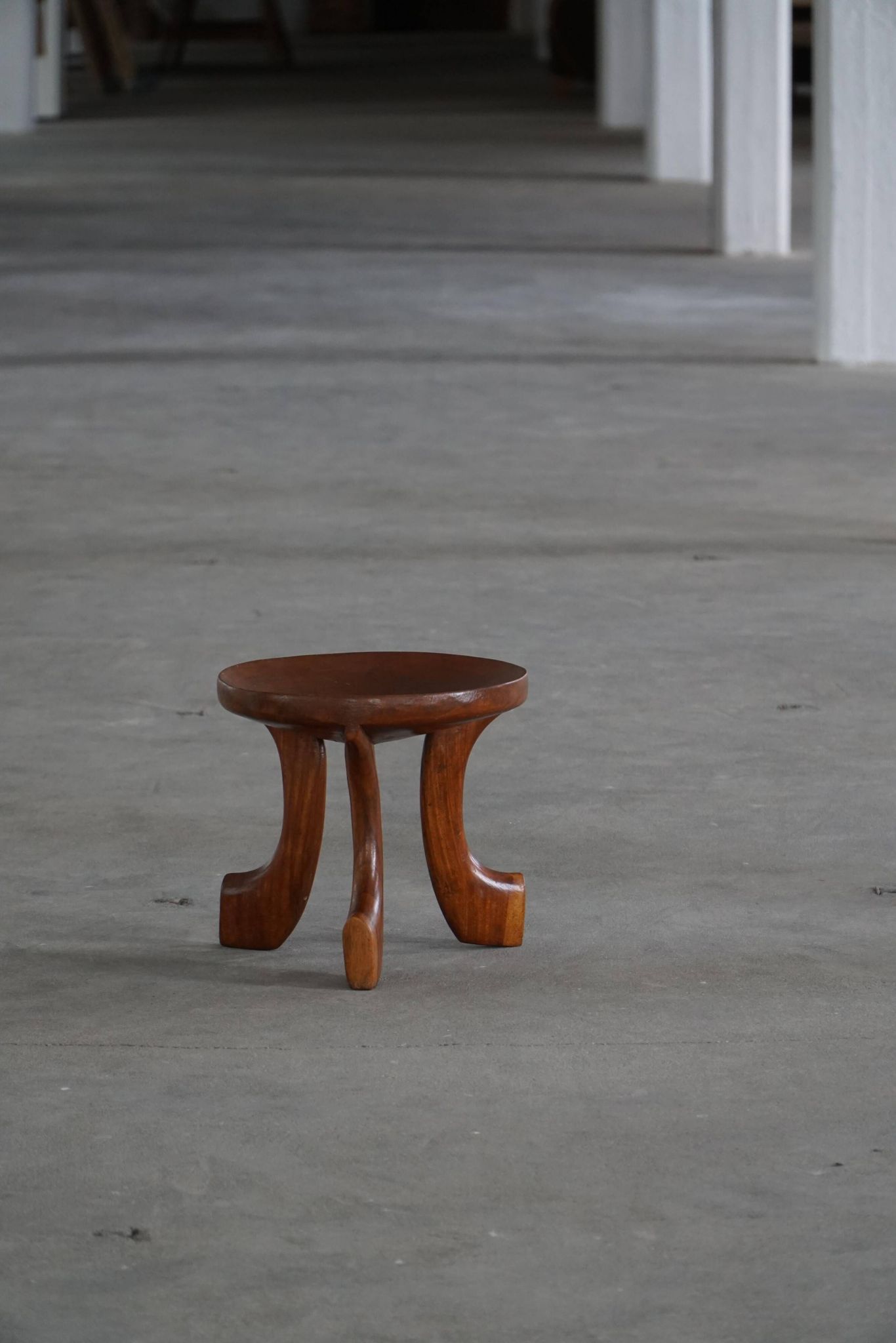 Oromo stool from mid-20th century Africa, hand-carved wood, tribal style.