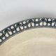 Round plate made of iron earth from Salins, late 19th century - early 20th century.