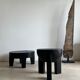 Black mango wood tripod side table with a semi-spherical top, height: 45 cm, diameter: 44 cm.