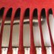 Service de 12 couteaux de table orfèvre Deetjen en écrin