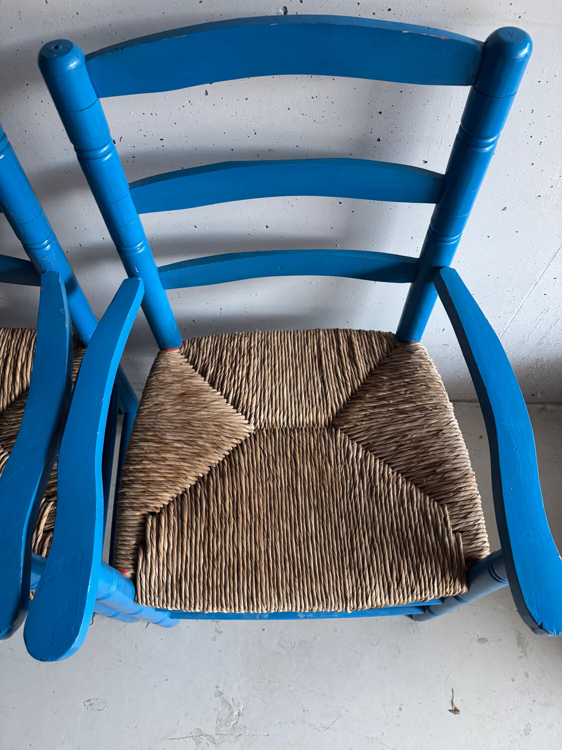 Pair of Provençal armchairs in painted wood and straw, around 1960.