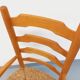 Vintage armchair in beech wood and straw from the 1950s.