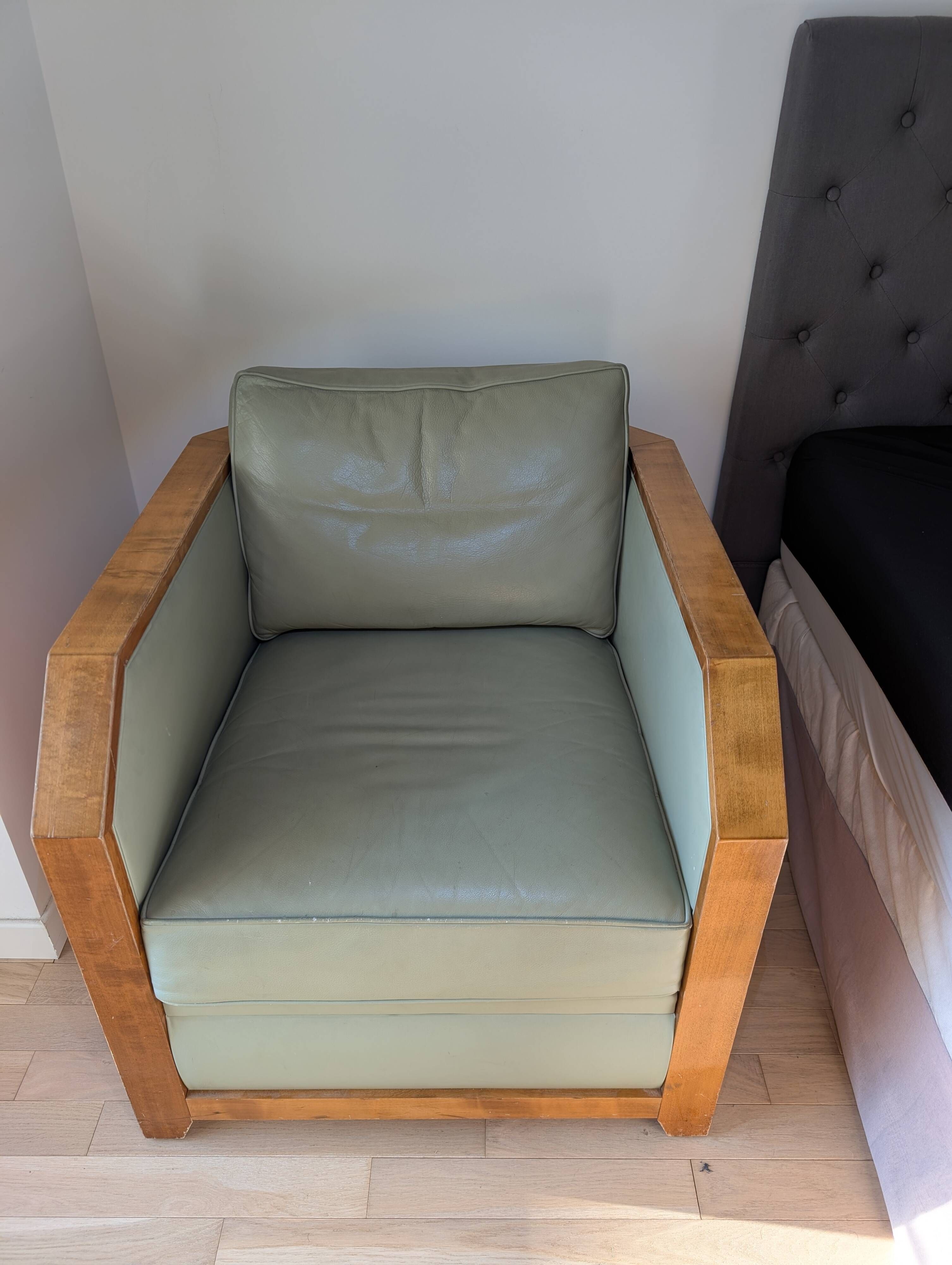 Vintage armchair Hugues Chevalier Paris — Almond green leather & Wood