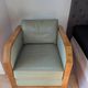 Vintage armchair Hugues Chevalier Paris — Almond green leather & Wood