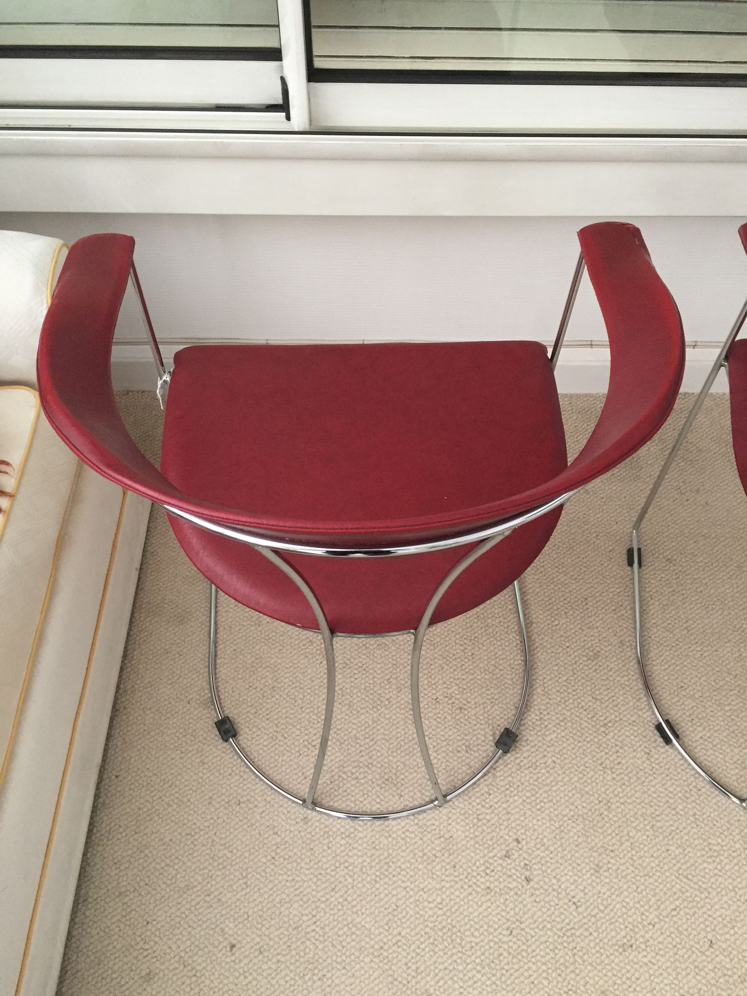 Pair of red chairs in 80s skai