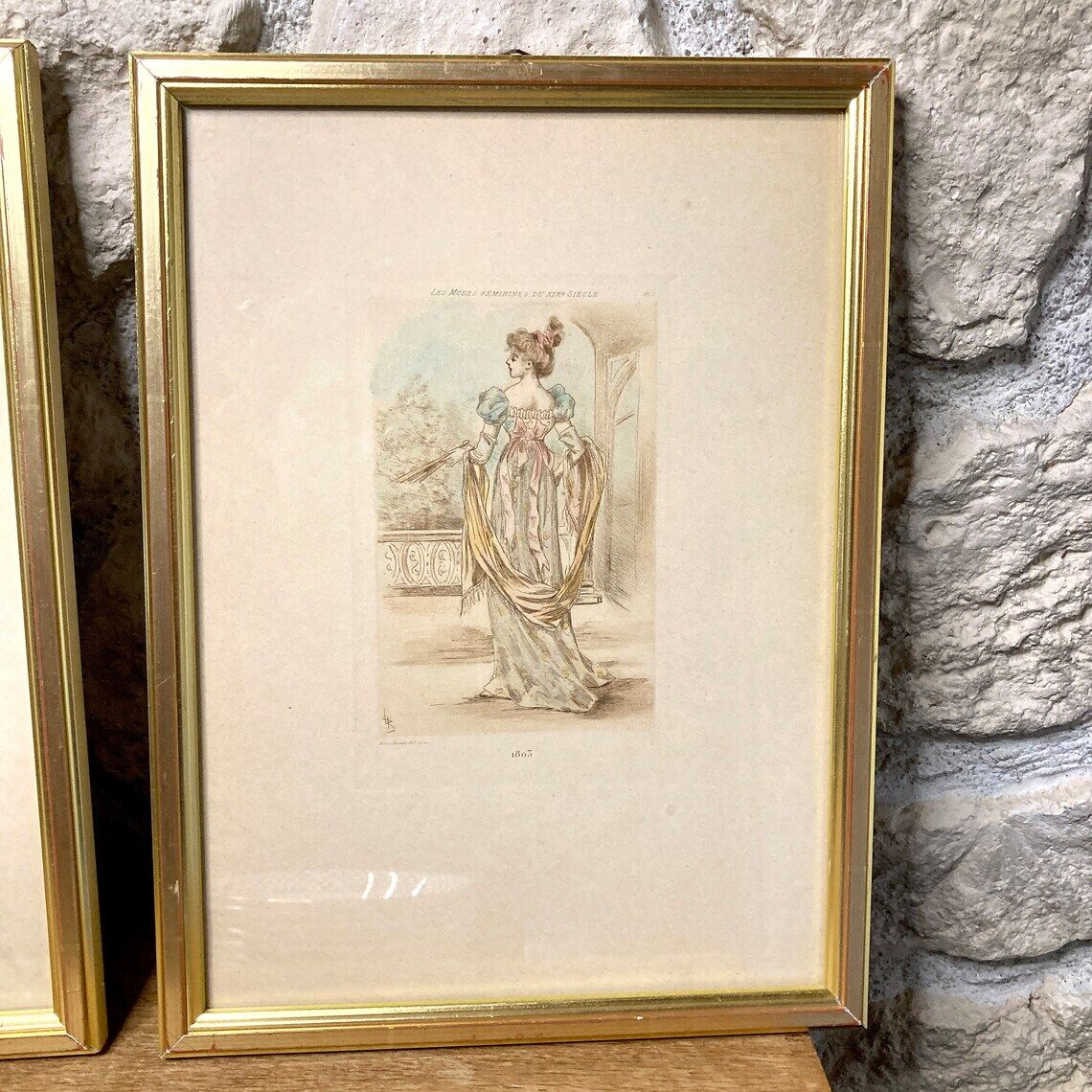 Set of two framed mode engravings