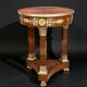 Circular gueridon empire of the 19th century in marquetry ornamented with gilt bronze