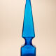 large blue glass obelisk-shaped bottle or vase
