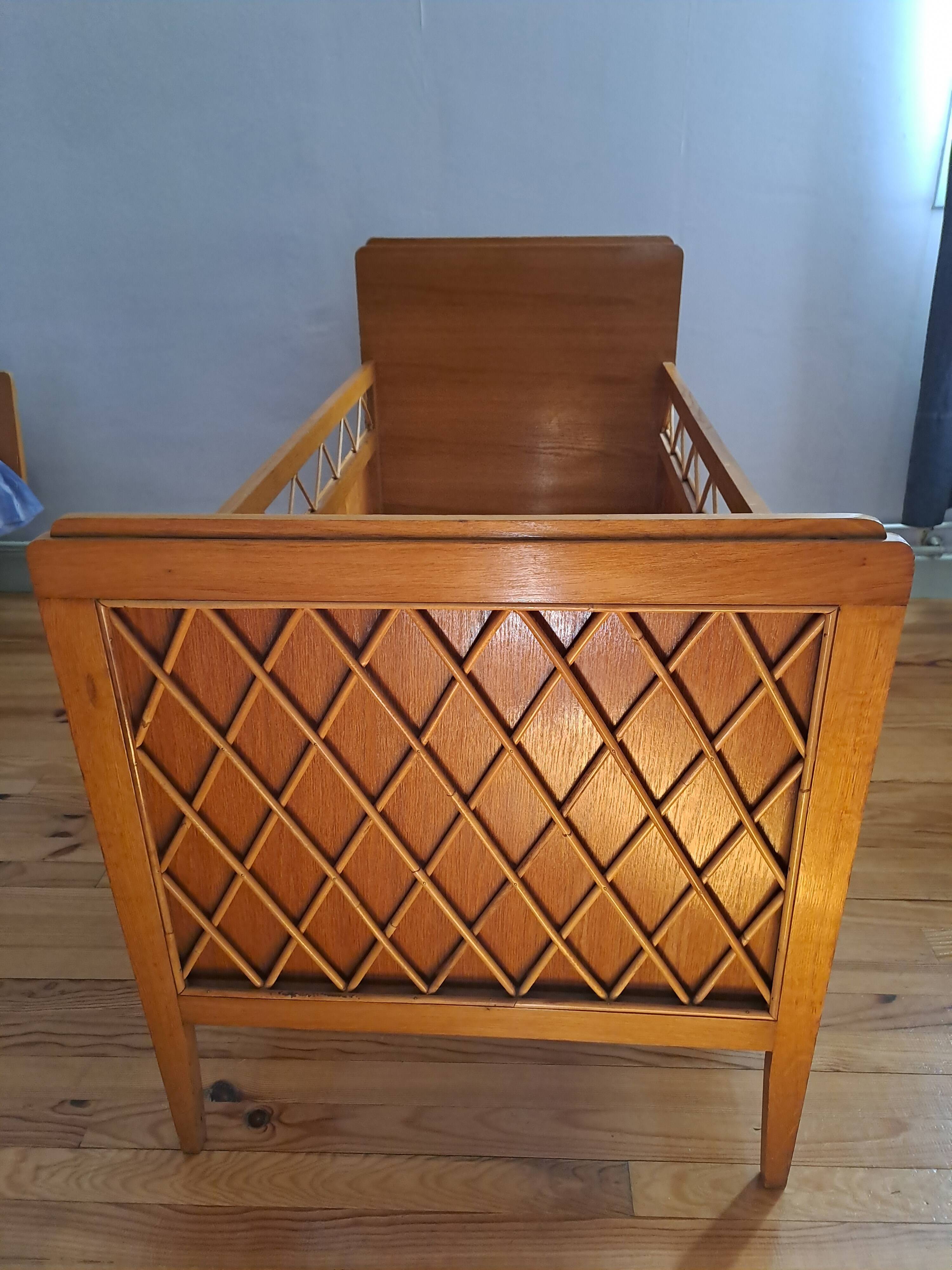 Solid wood and rattan baby bed from the 1960s