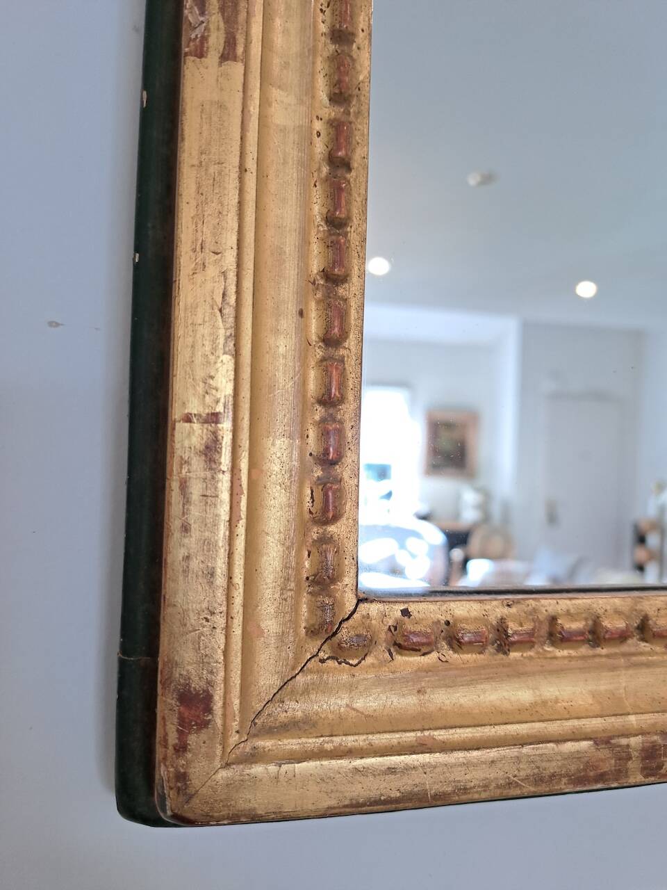 Antique mirror in wood and gilded stucco