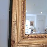 Miroir ancien en bois et stuc doré