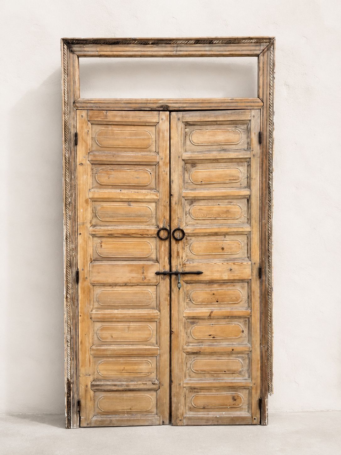 pair of old double-leaf doors with transom and carved frames