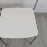 Modernist chair in chrome metal and white laminate, 1960s style.