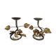 Pair of brass candle holders decorated with patinated metal flowers