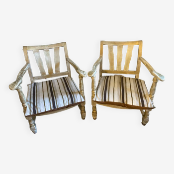 A pair of low armchairs