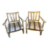 A pair of low armchairs