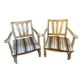 A pair of low armchairs