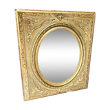 Mirror XIXth medallion on gilded frame with leaf