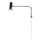 Minimalist metal wall light in the style of Jean Prouvé, circa 1950.