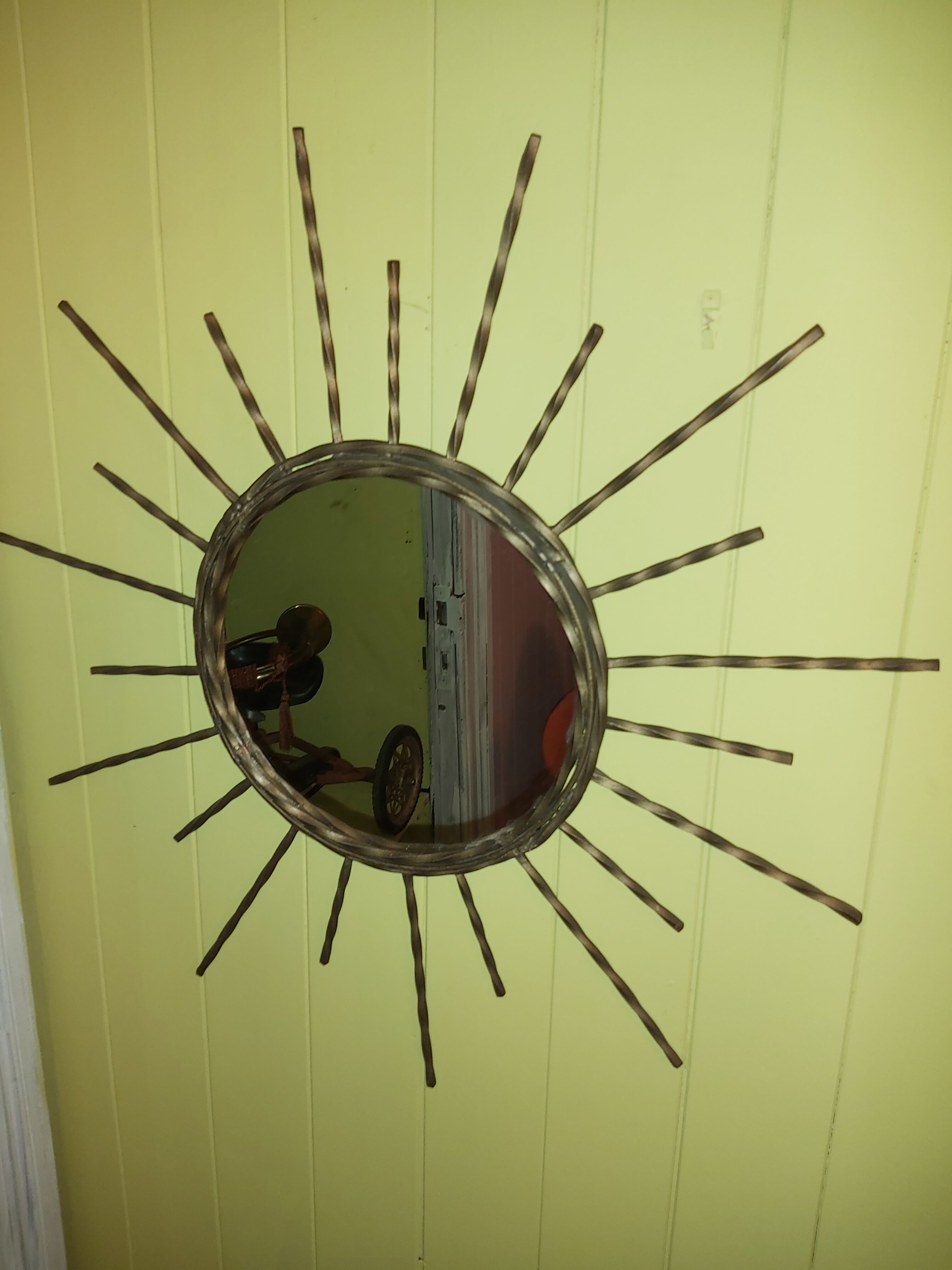 Wrought iron sun mirror.
