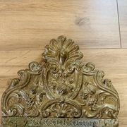 Small mirror with repoussé brass frame.
